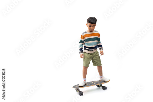 ".Colorful long sleeve shirt. Excited happy smilling boy playing skateboard. Portrait Young Asian thai cute boy standing on white background banner. Sport man" © NVB Stocker