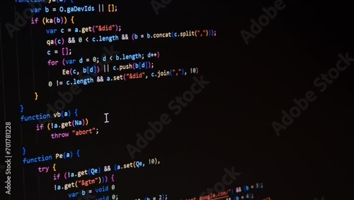 Code. Colorful jsx javascript computer programming code scroll close up pixel detail shot 4K super macro on screen.
