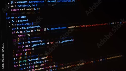 Code. Colorful jsx javascript computer programming code scroll close up pixel detail shot 4K super macro on screen.