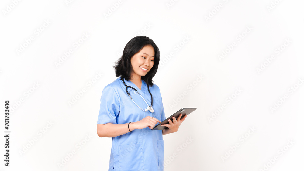 Young Asian female doctor using tablet for work and smiling isolated on white background Young Asian female doctor using tablet for work and smiling isolated on white background