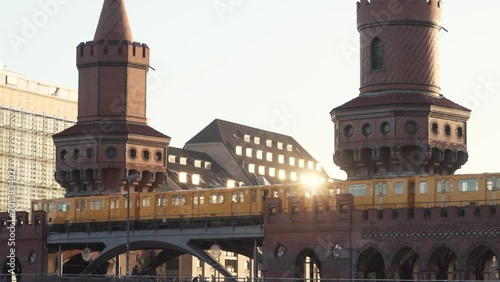 yellow subway train crossing oberbaum Bridge in Berlin