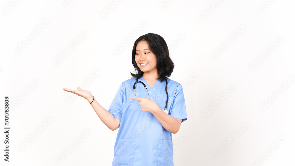 Young Asian female doctor pointing copy space on palm hand isolated on white background Young Asian female doctor pointing copy space on palm hand isolated on white background
