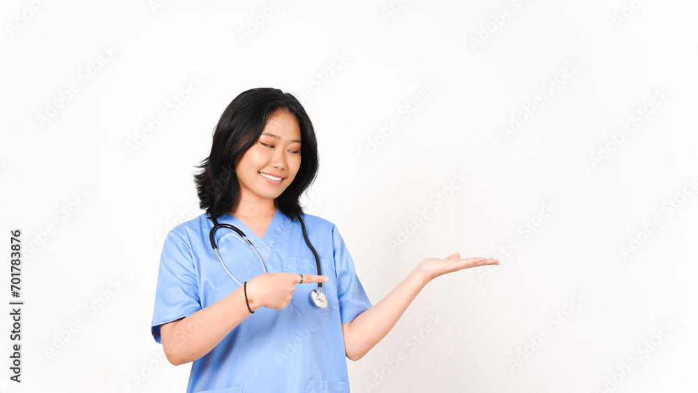 Young Asian female doctor pointing copy space on palm hand isolated on white background Young Asian female doctor pointing copy space on palm hand isolated on white background