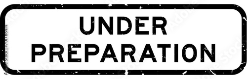 Grunge black under preparation word square rubber seal stamp on white background