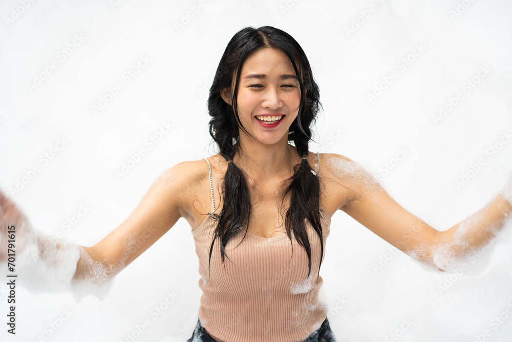Portrait sexy girl in pool party. Foam party summer entertainment, Happy smiling sexy young woman on beach foam party Portrait sexy girl in pool party. Foam party summer entertainment, Happy smiling sexy young woman on beach foam party