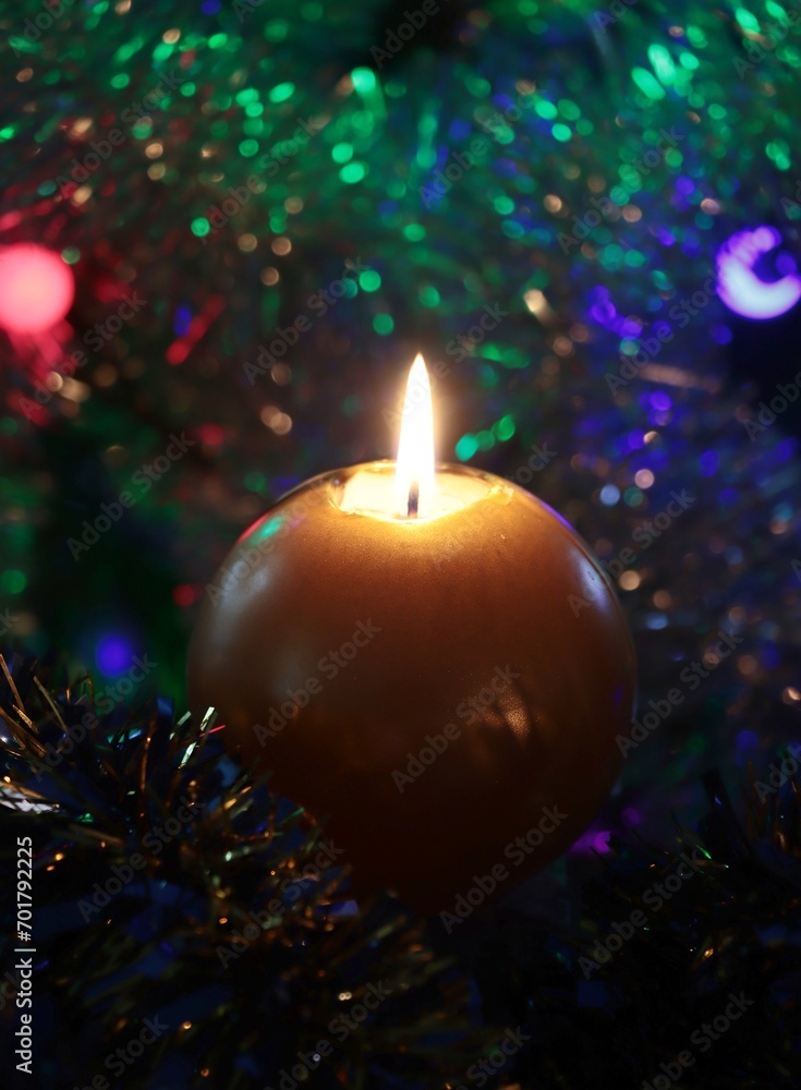 burning candle and christmas tree 