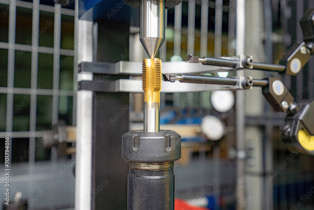 A machine for checking cutters and cutting tools for runout in the centers using indicators. A machine for checking cutters and cutting tools for runout in the centers using indicators.
