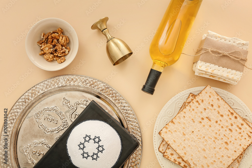 Composition with bottle of wine, cup, Passover Seder plate, flatbread matza and walnuts on color background Composition with bottle of wine, cup, Passover Seder plate, flatbread matza and walnuts on color background