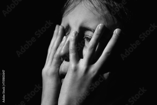 Wallpaper Mural Close up crying young girl. Loneliness, depression, pain, child tragedy. Black and white image. Torontodigital.ca