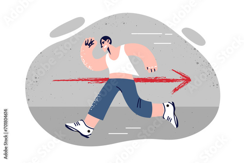 Man runs in opposite direction from arrow demonstrating non-conformism and lack agreement with rules