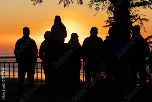 People watching the sunset along the beach