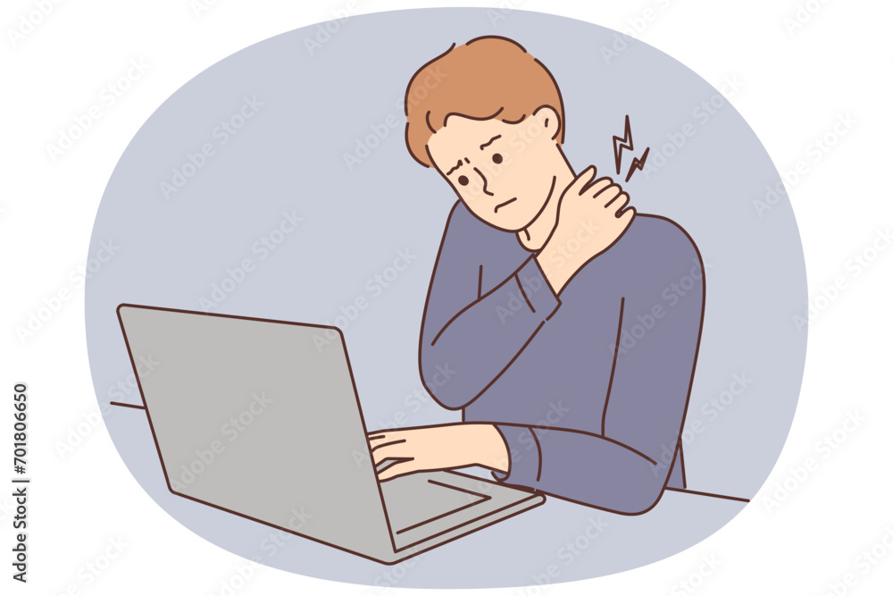 Tired man suffer from backache working on computer Tired man suffer from backache working on computer