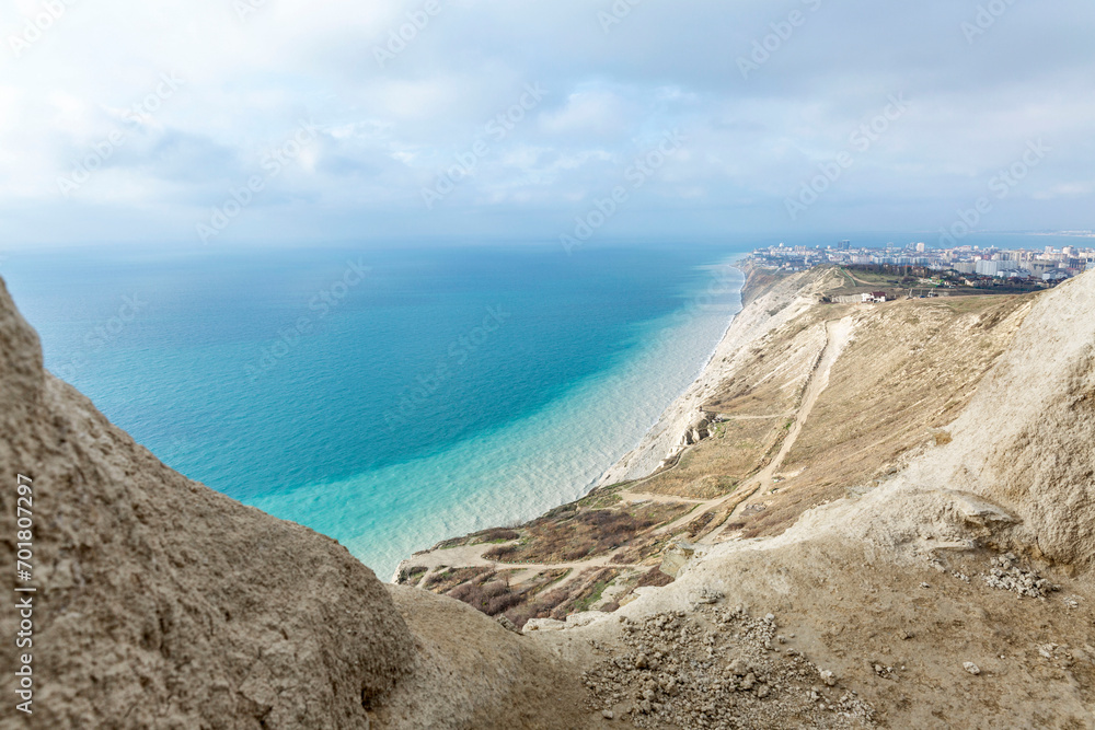 Beautiful view of the turquoise sea from above from the mountains on a sunny day. Rest and relaxation at the resort. Magnificent landscape. Beautiful view of the turquoise sea from above from the mountains on a sunny day. Rest and relaxation at the resort. Magnificent landscape.