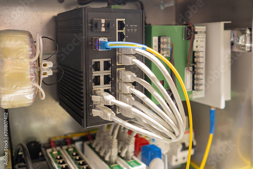 Industrial internet equipment. Network switch in steel cabinet. Low-current system. Internet equipment for enterprises. Network switch for distributing internet streams. Industrial network tech photo