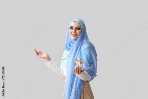 Young Muslim woman with lan...