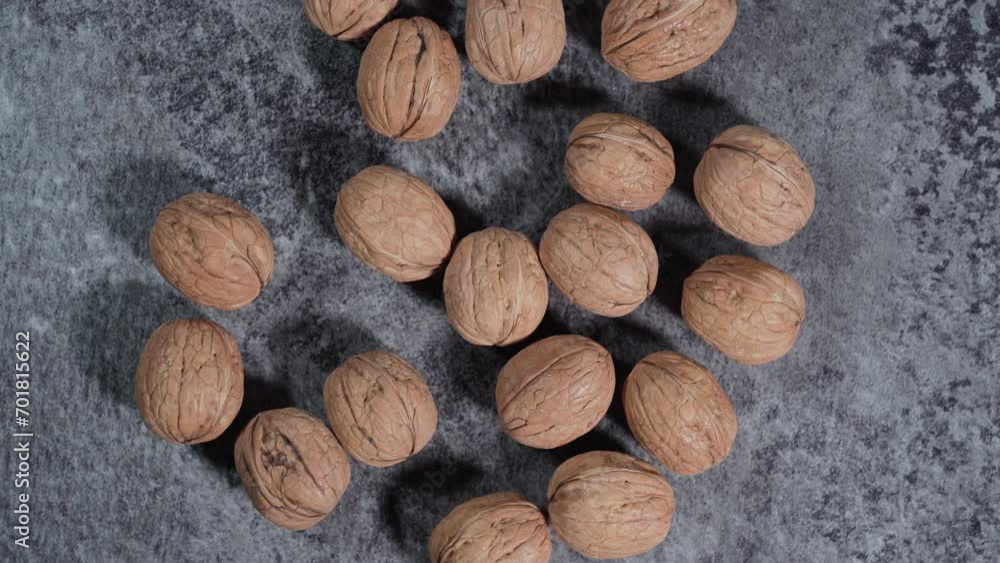 Whole walnuts in shells on dark background. Fresh organic nuts. Top overhead view. Whole walnuts in shells on dark background. Fresh organic nuts. Top overhead view.
