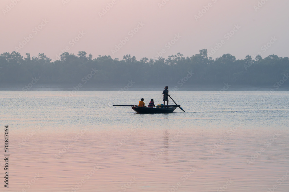 Beautiful Boat in river at dawn. Foggy landscape with boat during sunset on traditional boat in Sundarbans. Beautiful Boat in river at dawn. Foggy landscape with boat during sunset on traditional boat in Sundarbans.