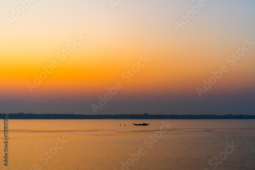 Beautiful Boat in river at dawn. Foggy landscape with boat during sunset on traditional boat in Sundarbans. 