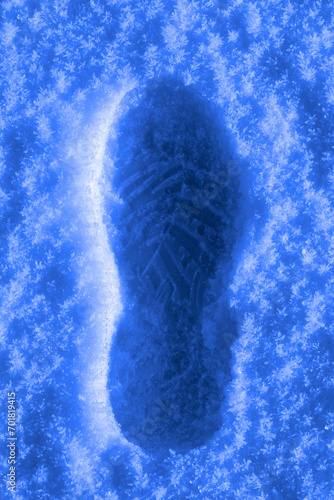 Footprint or Boot Track in Fresh Snow with Ice Crystals Walking in Winter