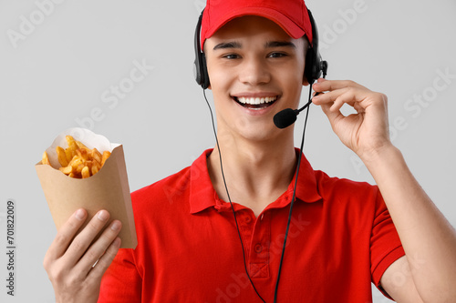 Male worker with french fri...