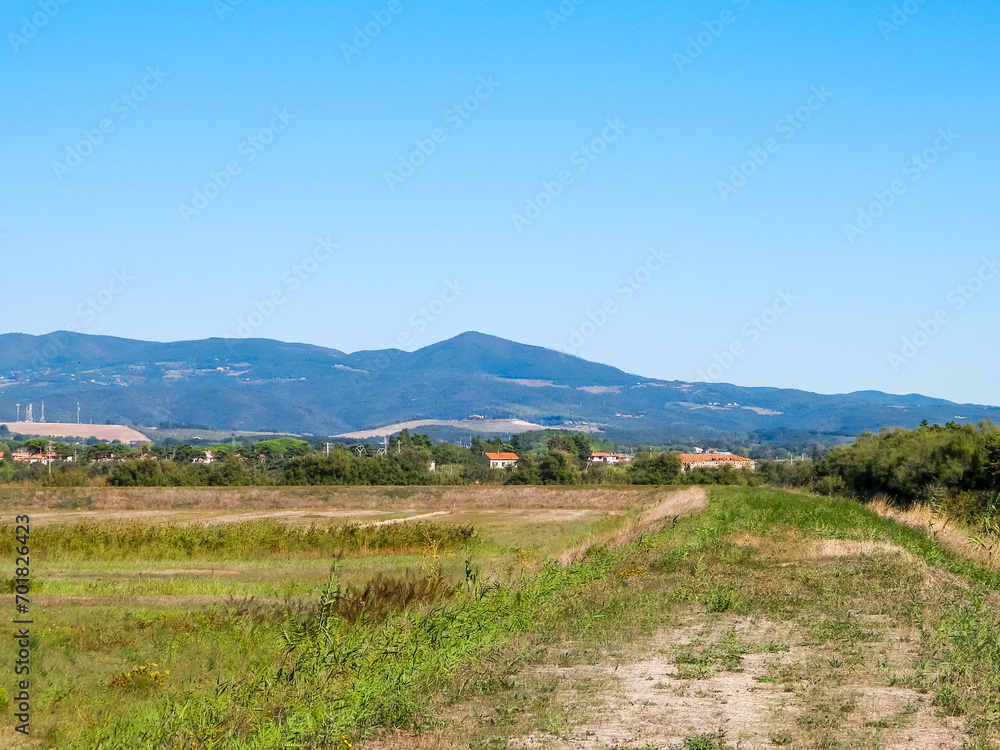 Tuscany, view of meadow and Apennines in the background.