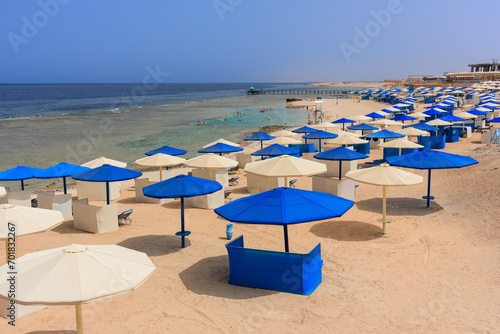 Sun loungers with umbrellas on the beach in Marsa Alam at sunrise, Egypt © Patryk Kosmider