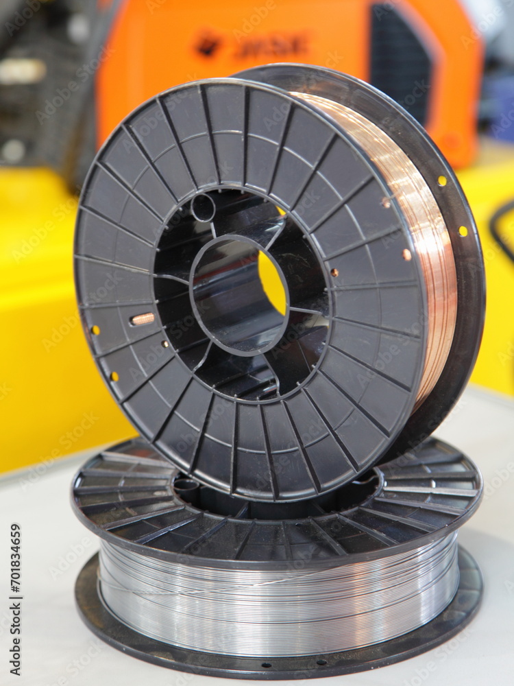 Two Welding wire coils closeup. MIG MAG automatic welding equipment