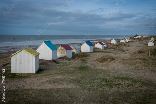 Gouville, France - 12 30 2023: View of colorful bathing wooden cabins of Gouville on the dunes.