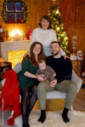 Cute newborn child, baby boy, with mom and dad on Christmas © Tomsickova