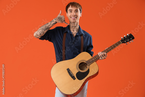 Male artist with guitar sho...