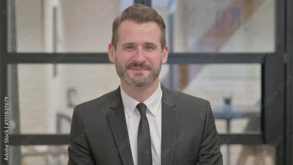 Portrait of Middle Aged Businessman Waving Hand to Say Hello Portrait of Middle Aged Businessman Waving Hand to Say Hello
