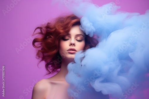Young woman surrounded by a purple pink cloud of steam
