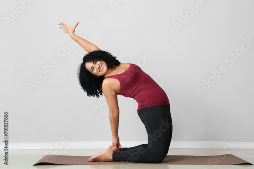 Sporty adult woman practici...