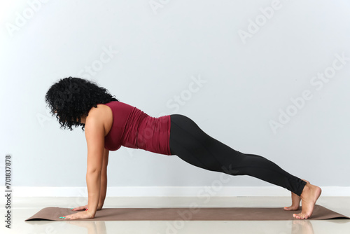 Sporty adult woman practici...