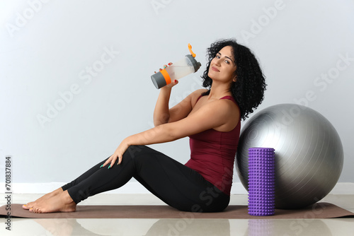Sporty adult woman with fit...