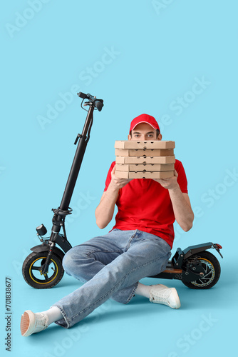 Male courier with pizza box...
