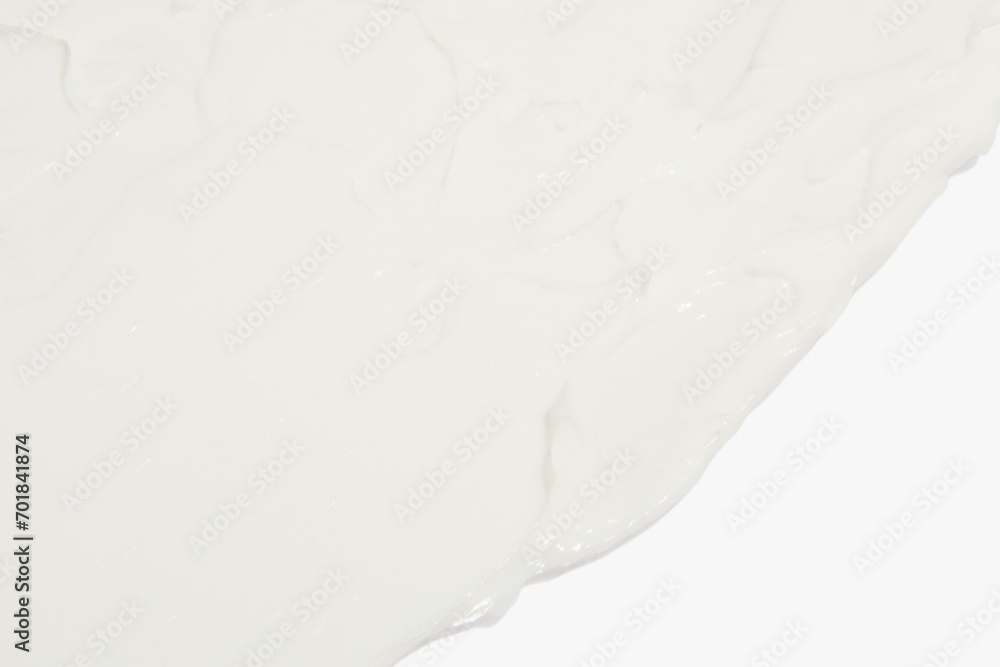 Obraz premium White cosmetic cream smeared on a white background.