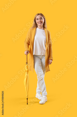 Mature woman with umbrella ...