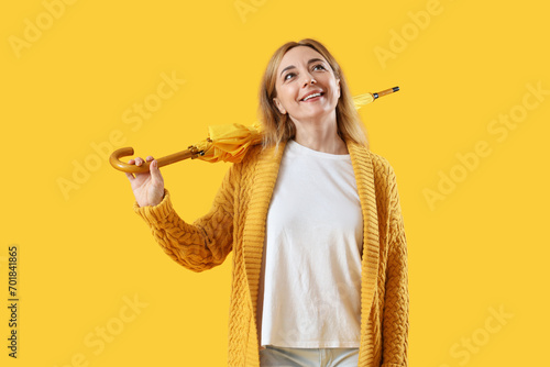 Mature woman with umbrella ...