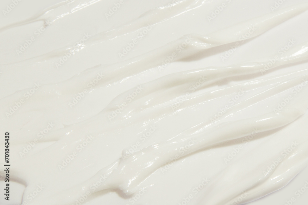 Thick white cosmetic cream applied to the surface. texture of the cream close-up. Thick white cosmetic cream applied to the surface. texture of the cream close-up.