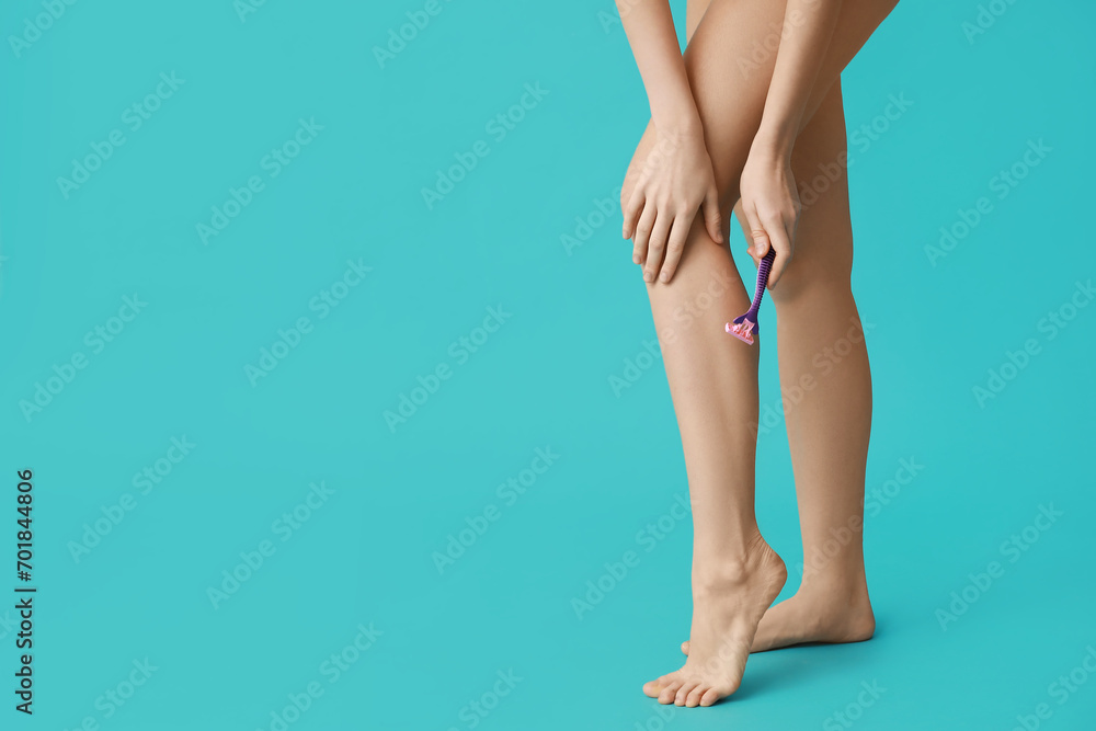 Beautiful young woman with razor shaving legs on turquoise background, closeup Beautiful young woman with razor shaving legs on turquoise background, closeup