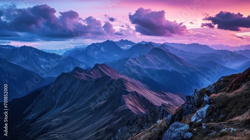 A breathtaking landscape photograph featuring mountains, vibrant colors, dramatic lighting, a wide-angle viewpoint, outstanding exposure, and a dynamic twilight sky.  © Matthew