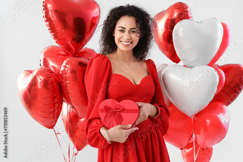 Smiling woman in red dress ...
