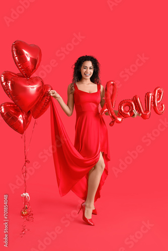 Smiling woman in red dress ...