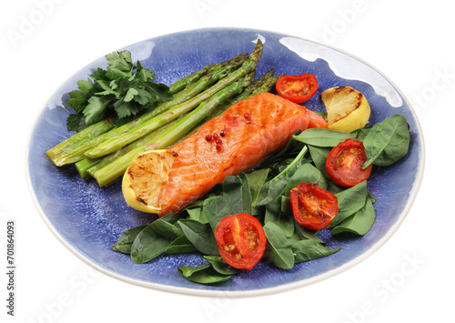 Tasty grilled salmon with tomatoes, asparagus, lemon and basil isolated on white