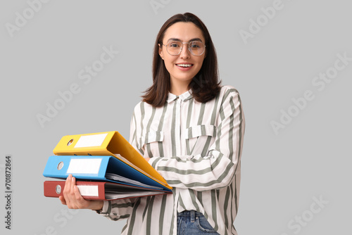 Young businesswoman with do...