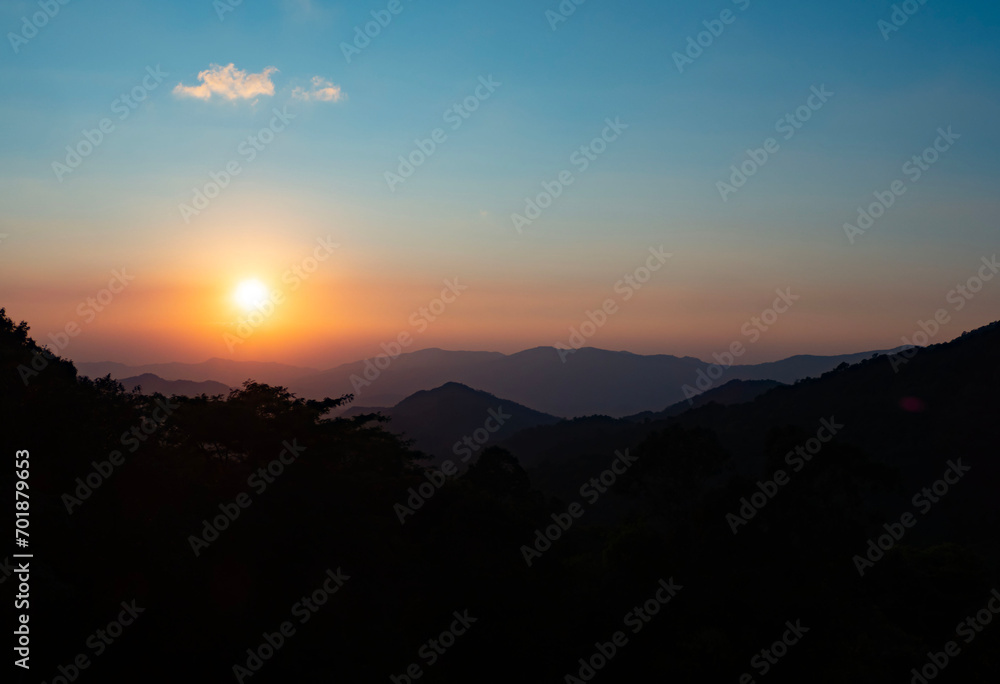 Obraz premium Scenic view at sunset time with silhouette mountain view at Phu Chi Fa Forest Park in Chiang Rai, Thailand.