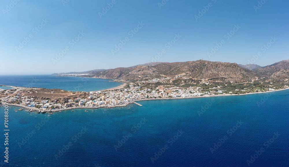 Palaiochora town, Crete island Greece. Aerial drone panoramic view of sea water, seaside building.