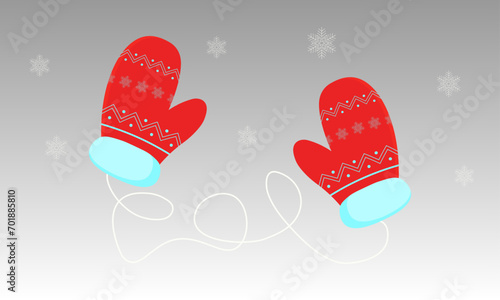 Red mittens on a gray background. Winter mittens in childrens style. 