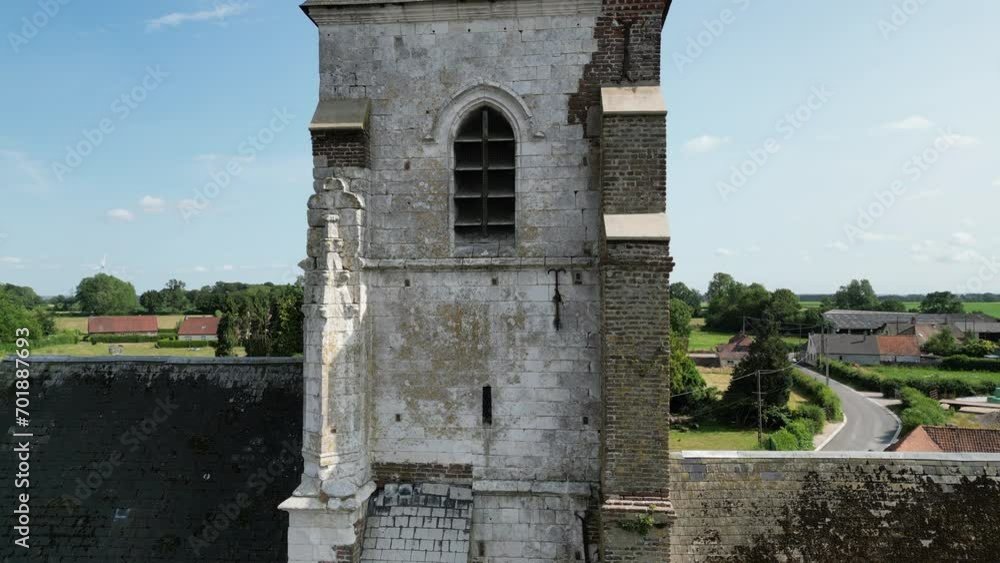 Aerial of old church with weather vane in French rural village. Riser from building to weather vane (cock) and view of surroundings. Aerial of old church with weather vane in French rural village. Riser from building to weather vane (cock) and view of surroundings.